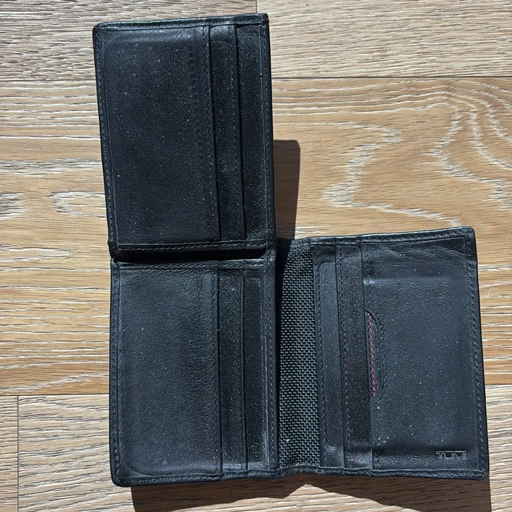 Tumi black men’s wallet with photo ID pocket